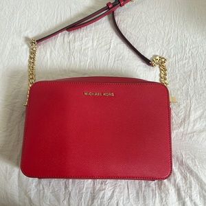 Ever used red Michael Kors purse